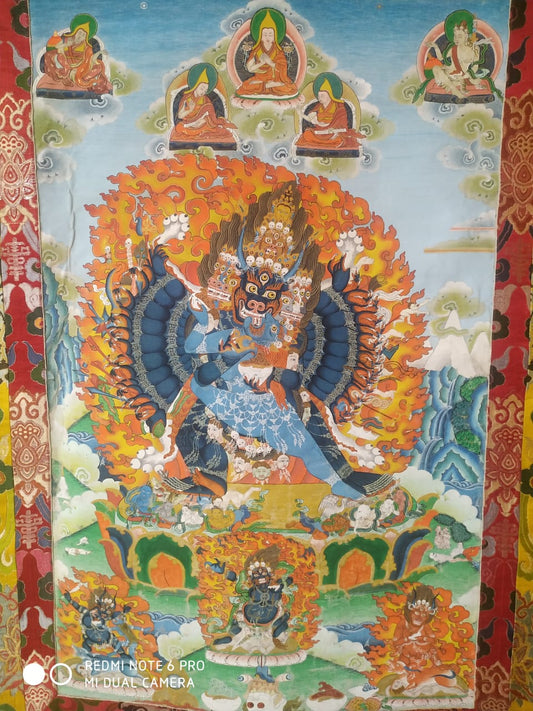 Thangka of Yamantaka (Vajrabhairava / Dorje Jigje), the wrathful buffalo-headed deity wreathed in flame, with Je Tsongkhapa and Gelug lineage masters above, at Sed Gyued Monastery